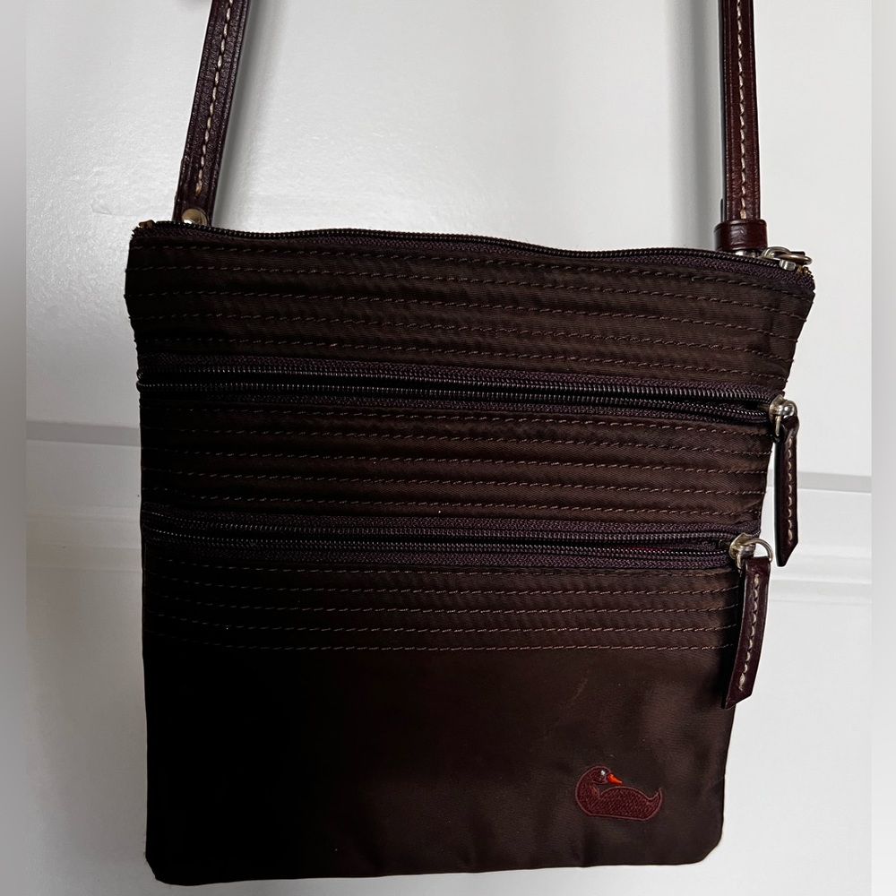 Dooney & Bourke nylon North South triple zip crossbody bag